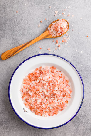 Pink Himalayan salt in a bowl. Top view.の写真素材