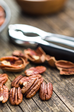Peeled pecan nuts on the wooden table.の写真素材