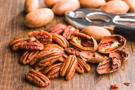 Peeled pecan nuts on the wooden table.の写真素材