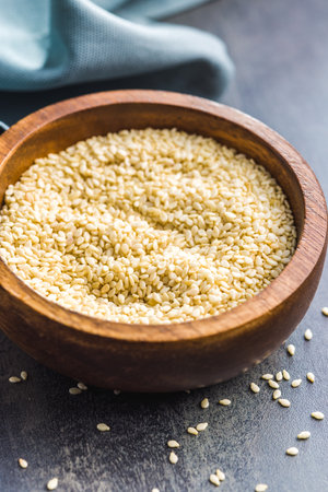 Dried sesame seeds in the wooden bowl.の写真素材