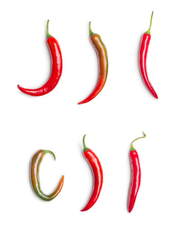 Red chili peppers. Hot spice peppers isolated on the white background.の写真素材
