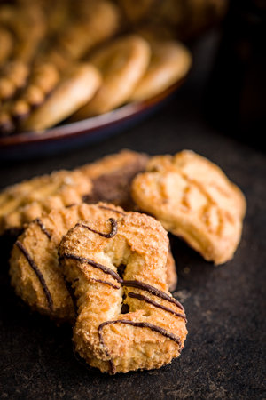 Assorted various cookies. Sweet biscuits on the black table.の写真素材