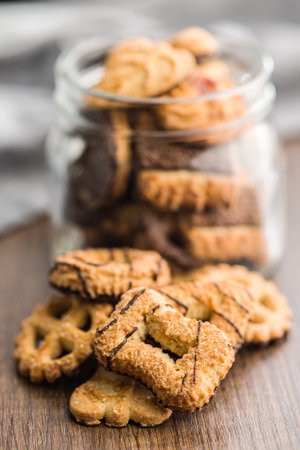Assorted various cookies. Sweet biscuits on the wooden table.の写真素材