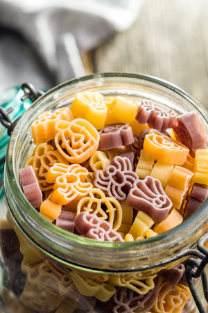Pasta of various scary shapes. Uncooked Halloween pasta in a jar.の写真素材