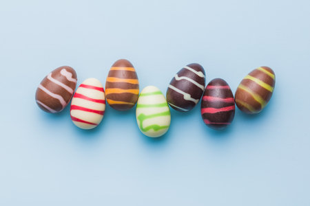 Chocolate easter eggs on the blue background. Top view.の写真素材
