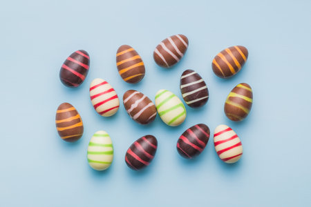 Chocolate easter eggs on the blue background. Top view.の写真素材