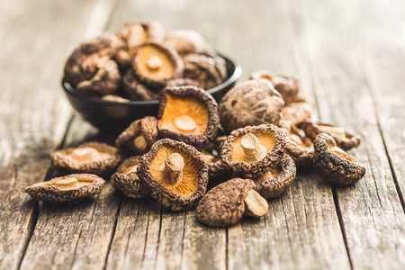 Dried shiitake mushrooms on the wooden table.の写真素材