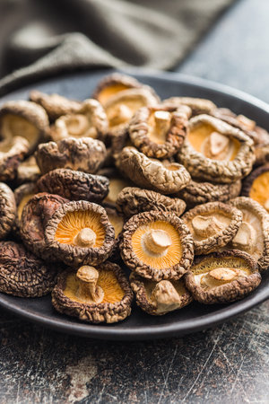 Dried shiitake mushrooms on the kitchen table.の写真素材