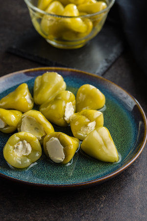 Peppers stuffed with cream cheese on the plate.の写真素材