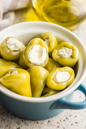 Peppers stuffed with cream cheese in the pot.の写真素材