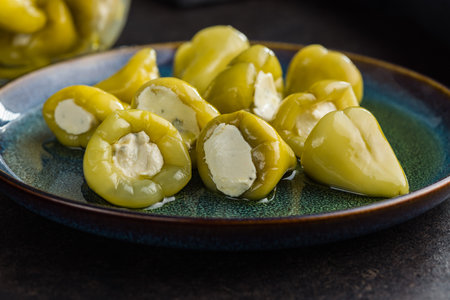 Peppers stuffed with cream cheese on the plate.の写真素材