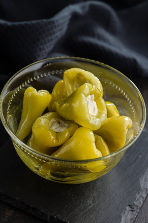 Peppers stuffed with cream cheese in the bowl.の写真素材