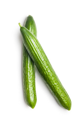 Fresh green cucumbers isolated on the white background.の写真素材