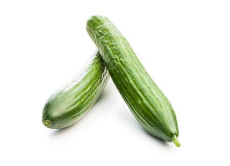 Fresh green cucumbers isolated on the white background.の写真素材