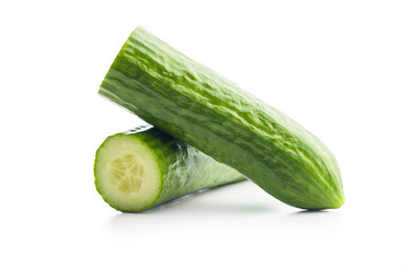 Sliced fresh green cucumber isolated on the white background.の写真素材