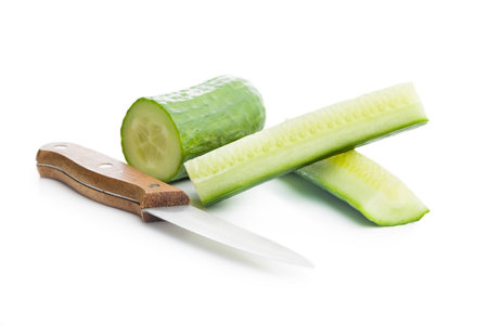 Sliced fresh green cucumber isolated on the white background.の写真素材