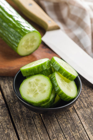 Sliced fresh green cucumber in the bowl.の写真素材