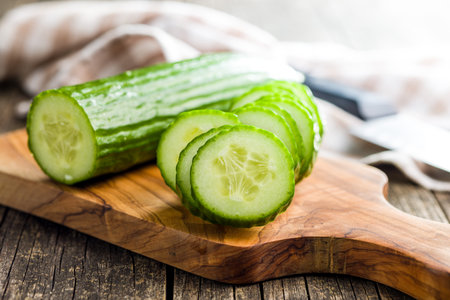 Sliced fresh green cucumber on the cutting board.の写真素材