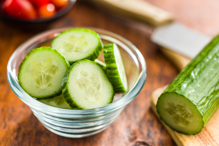 Sliced fresh green cucumber in the bowl.の写真素材