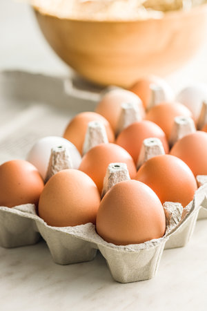 Whole chicken eggs in the eggbox.の写真素材