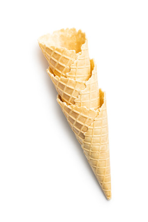 Empty wafer cone. Sweet ice cream cone isolated on the white background.の写真素材