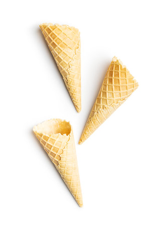Empty wafer cone. Sweet ice cream cone isolated on the white background.の写真素材