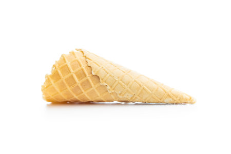 Empty wafer cone. Sweet ice cream cone isolated on the white background.の写真素材