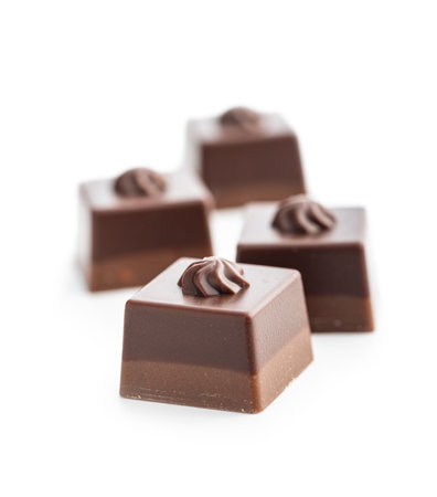 Sweet chocolate pralines. Tasty chocolate truffles isolated on the white background.の写真素材