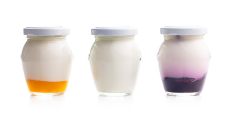 White and fruity yogurt in a jar isolated on the white background.の写真素材