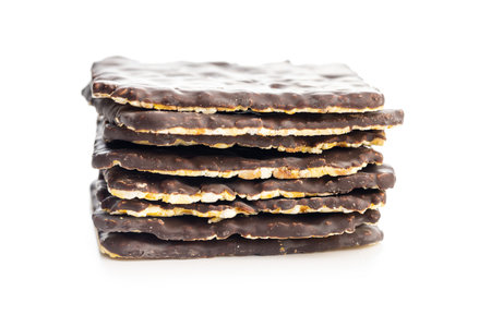 Puffed corn crackers chocolate covered isolated on the white background.の写真素材