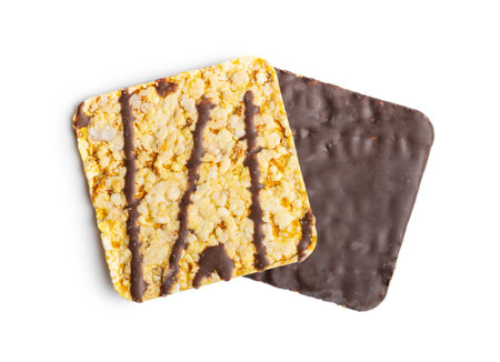 Puffed corn crackers chocolate covered isolated on the white background.の写真素材
