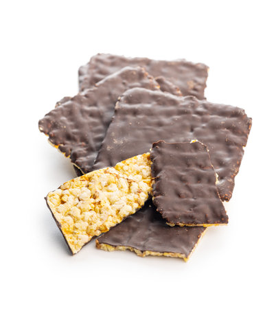 Puffed corn crackers chocolate covered isolated on the white background.の写真素材