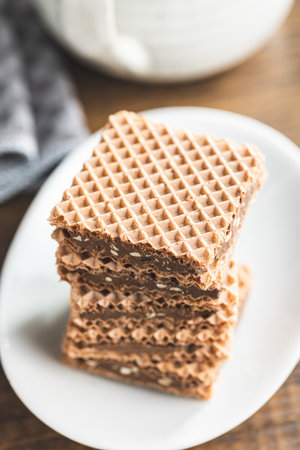 Sweet chocolate wafer on the plate.の写真素材