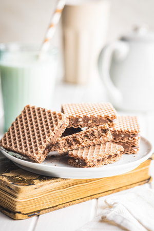 Sweet chocolate wafer on the plate.の写真素材