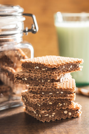 Sweet chocolate wafer on the wooden table.の写真素材