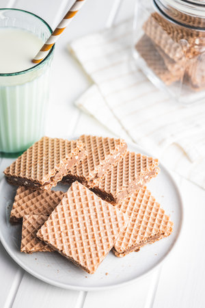 Sweet chocolate wafer on the plate.の写真素材