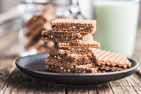 Sweet chocolate wafer on the plate.の写真素材