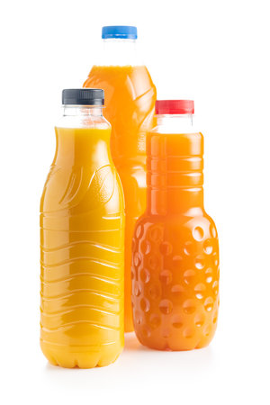 Three bottles of fruit juice. Orange juice isolated on the white background.の写真素材