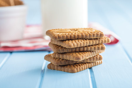 Sweet caramel biscuits. Tasty cookies on the blue table.の写真素材