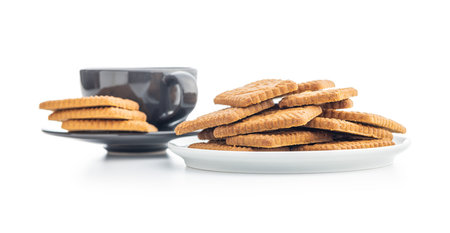 Sweet caramel biscuits. Tasty cookies on plate isolated on the white background.の写真素材