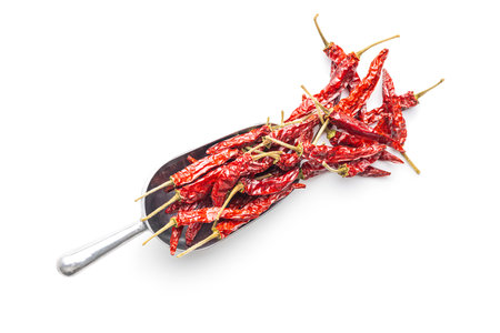 Red chili peppers in a scoop isolated on the white background.の写真素材