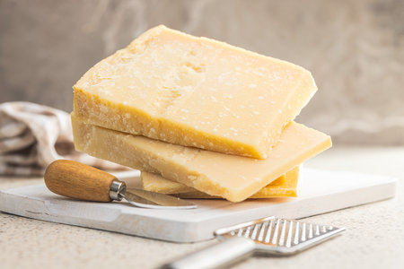 Tasty parmesan cheese on the kitchen table.の写真素材