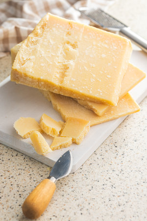 Tasty parmesan cheese on the kitchen table.の写真素材