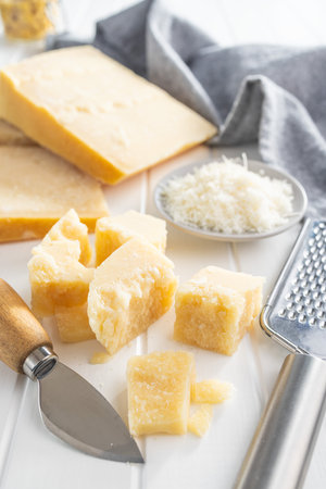 Tasty parmesan cheese on the white table.の写真素材