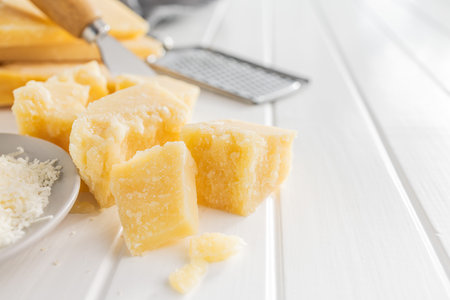 Tasty parmesan cheese on the white table.の写真素材