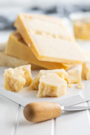 Tasty parmesan cheese on the white table.の写真素材