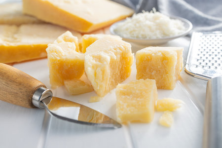 Tasty parmesan cheese on the white table.の写真素材