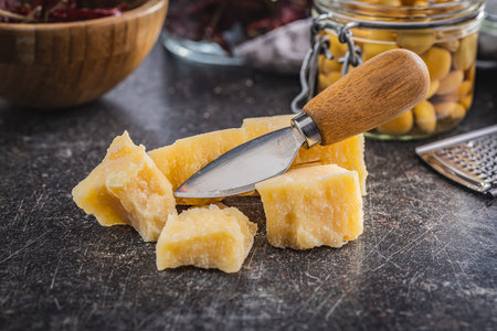 Tasty parmesan cheese on the kitchen table.の写真素材