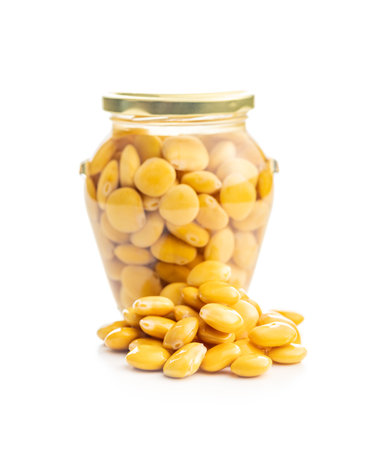 Lupini beans in brine. Pickled lupine in jar isolated on the white background.の写真素材