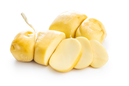 Smoked scamorza cheese isolated on the white background.の写真素材
